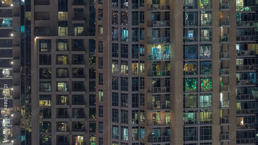 Big glowing windows in modern residential buildings timelapse at night Big glowing windows in modern residential buildings timelapse at night