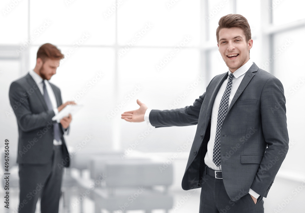 Young businessman invites to his office. Young businessman invites to his office.
