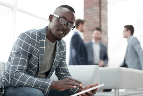 close up. businessman sitting in the lobby of the office