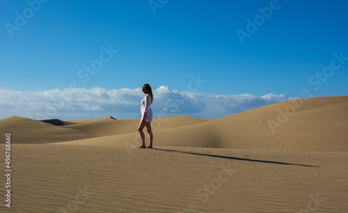 the girl in the desert dunes at dawn