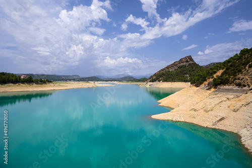 Deep turquoise river at the bottom of a vertical canyon