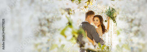 Wallpaper Mural Amazing smiling wedding couple. Pretty bride and stylish groom posing and kisses. Flowery Romantic moment. Torontodigital.ca