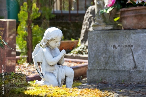 statue of a angel in a cemetery