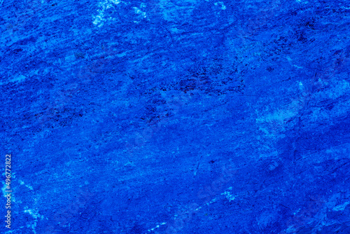 Abstract. Dark blue old concrete wall. The texture has an attractive unique pattern that is perfect for a Design background image.