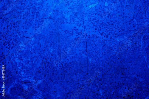 Abstract. Dark blue old concrete wall. The texture has an attractive unique pattern that is perfect for a Design background image.