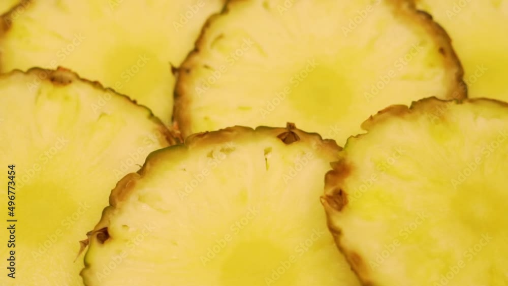 Cut Slices of Fresh Pineapple, Tropical Fruit, Isolated, Close-up, Rotation. Background of Sweet Pineapple Slices. Healthy Vegan Food and Vegetarian Diet. Cut Slices of Fresh Pineapple, Tropical Fruit, Isolated, Close-up, Rotation. Background of Sweet Pineapple Slices. Healthy Vegan Food and Vegetarian Diet.