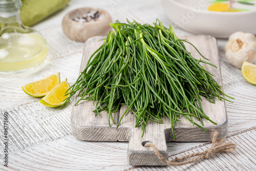 Fotografie Cooking Fresh Agretti or barba dei frati, edible green plant