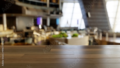 Empty wood table in a large restaurant mock up, blurred background