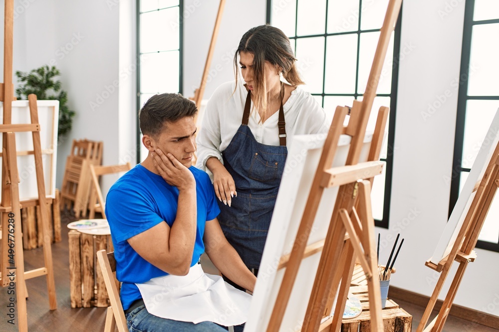 Teacher furious with paint student at art school. Teacher furious with paint student at art school.