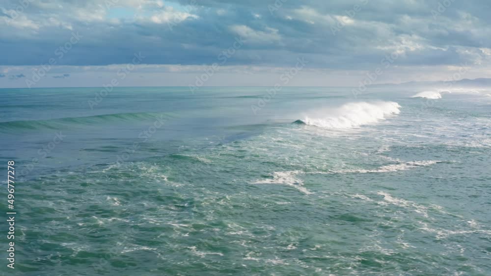 On the stormy waves of the ocean in a very dark and cloudy day On the stormy waves of the ocean in a very dark and cloudy day
