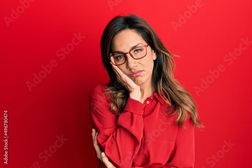 Young latin woman wearing casual clothes and glasses thinking looking tired and bored with depression problems with crossed arms.