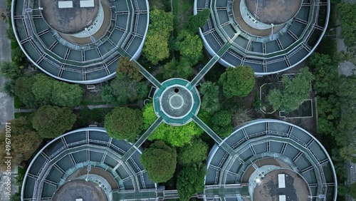 Drone aerial view of waterworks pool and tanks, top view. Environmental conservation, water treatment and industry concept b-roll footage. Water filtration pool in the waterworks, no people view