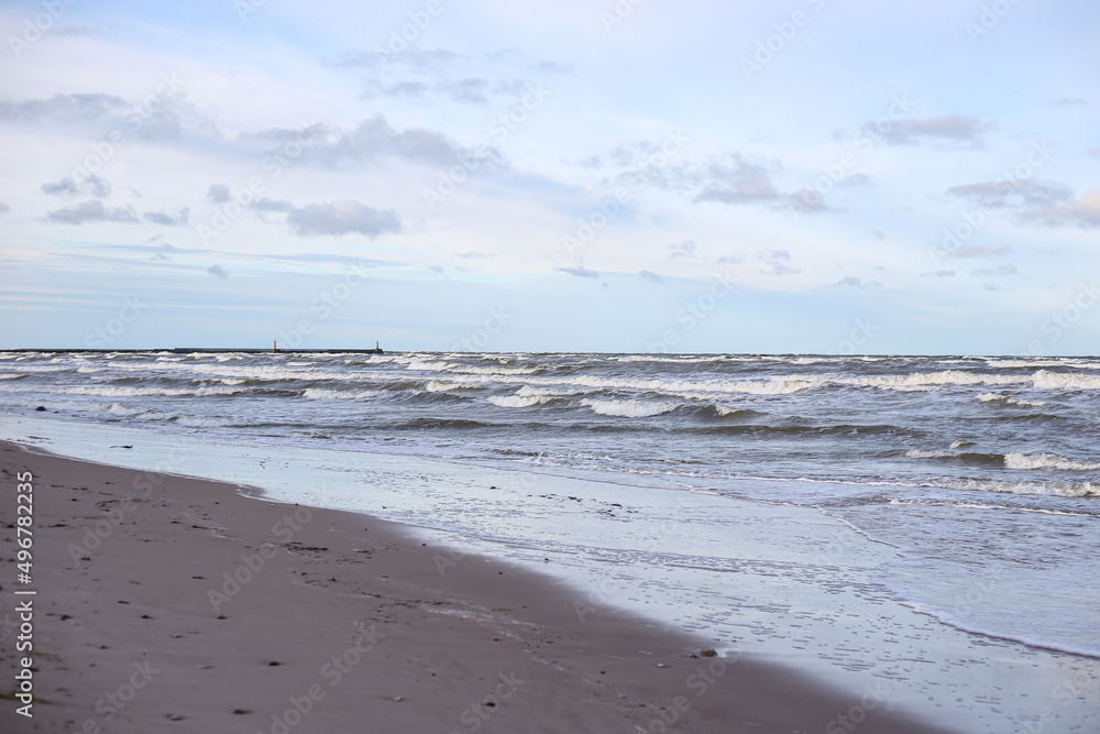 Baltic sea shoreside view with waves and cloudy weather. Baltic sea shoreside view with waves and cloudy weather.