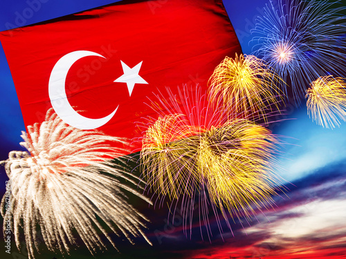 Photography Waving turkish flag against sunset sky with colorful exploding fireworks