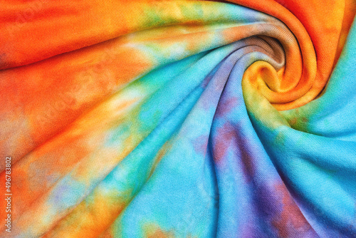 Abstract tie dye multicolor twisted fabric cloth Boho pattern texture for background or groovy wedding card, sale flyer, 60s, 70s poster, tie-dye diy backdrop. Modern Watercolor Wet Brush Fabrics Art photo