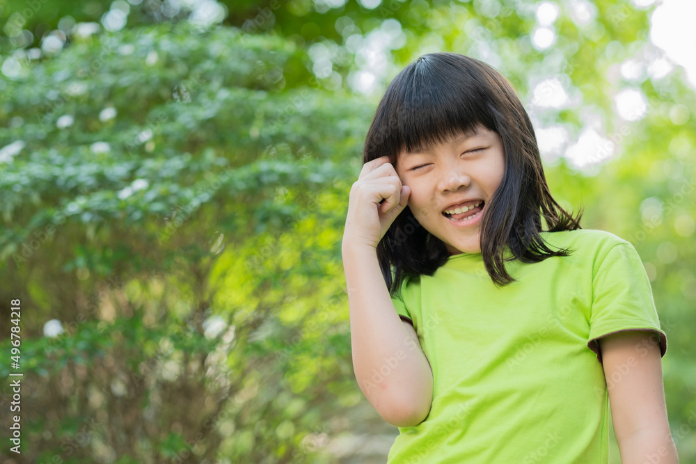 portrait asian kid, child enjoy and happy, the girl is smiling, thinking kid