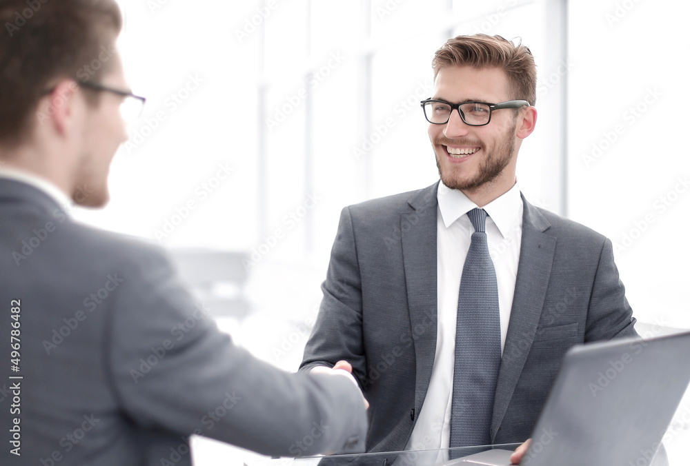 close up.smiling business people shaking hands in office close up.smiling business people shaking hands in office