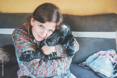Young single woman spending time with her pet