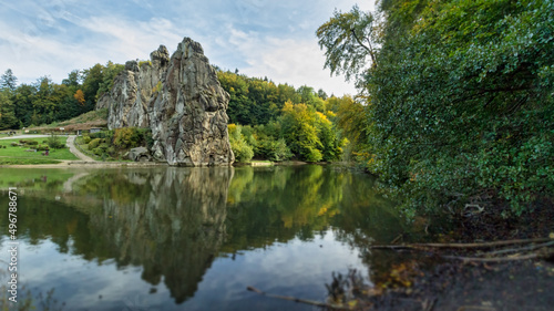 View over the lake to the stones of the Teutoburger forest photo