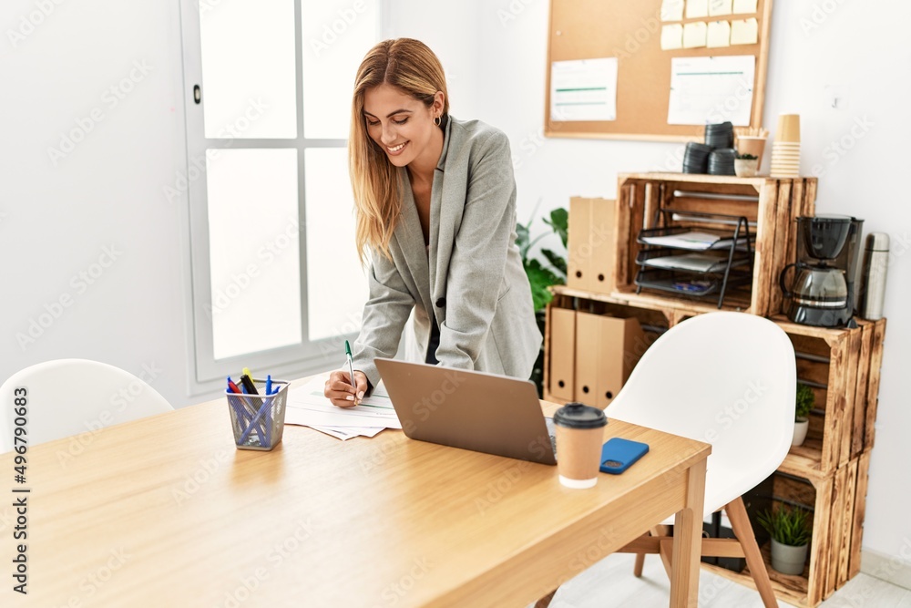Young caucasian businesswoman smiling happy working at the office. Young caucasian businesswoman smiling happy working at the office.