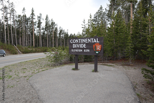 Closeup shot of the Continental Divide Sign in the forest photo