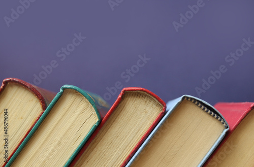 Few old books with purple background