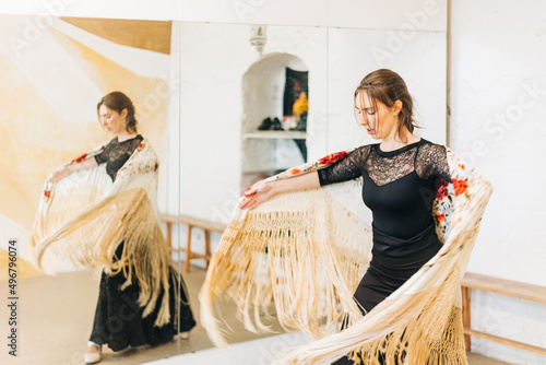 flamenco dancer reflected in the dance studio mirror