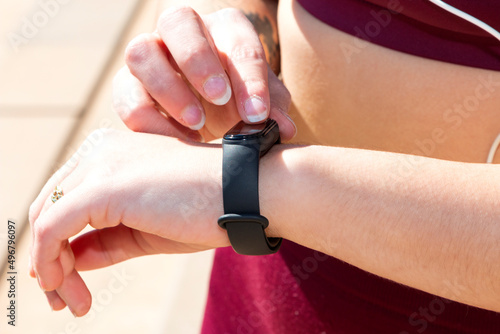 Close-up of girl touching her smart tracker