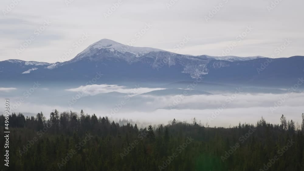 Panoramic view on the snowy mountain ridge with camera slowly panning left to right Panoramic view on the snowy mountain ridge with camera slowly panning left to right