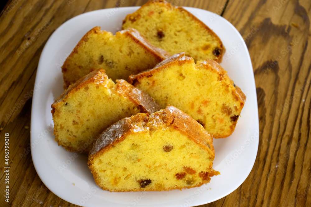 image of a delicious cupcake with raisins and candied fruit on a board close-up image of a delicious cupcake with raisins and candied fruit on a board close-up