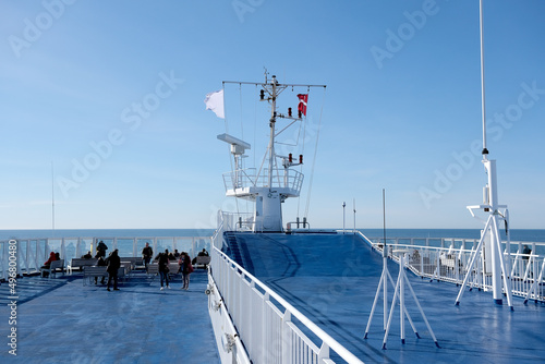 Adventure viking cruise to Faroe Islands and Iceland with Smyril passenger ferry Norrona Norroena in polar circle sea onboard on sunny day with views of ocean and open decks with superstructure photo