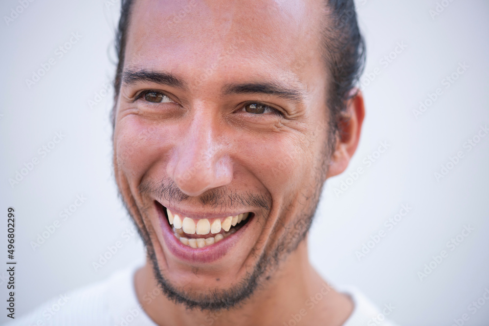 Close up face of cheerful young man Close up face of cheerful young man