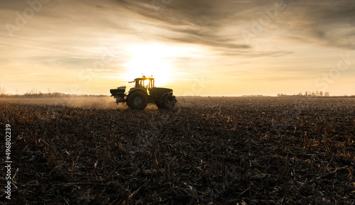 Bild auf Leinwand Tractor spreading artificial fertilizers in field