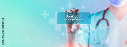 Book your appointment. Doctor holds virtual card in hand. Medicine digital photo