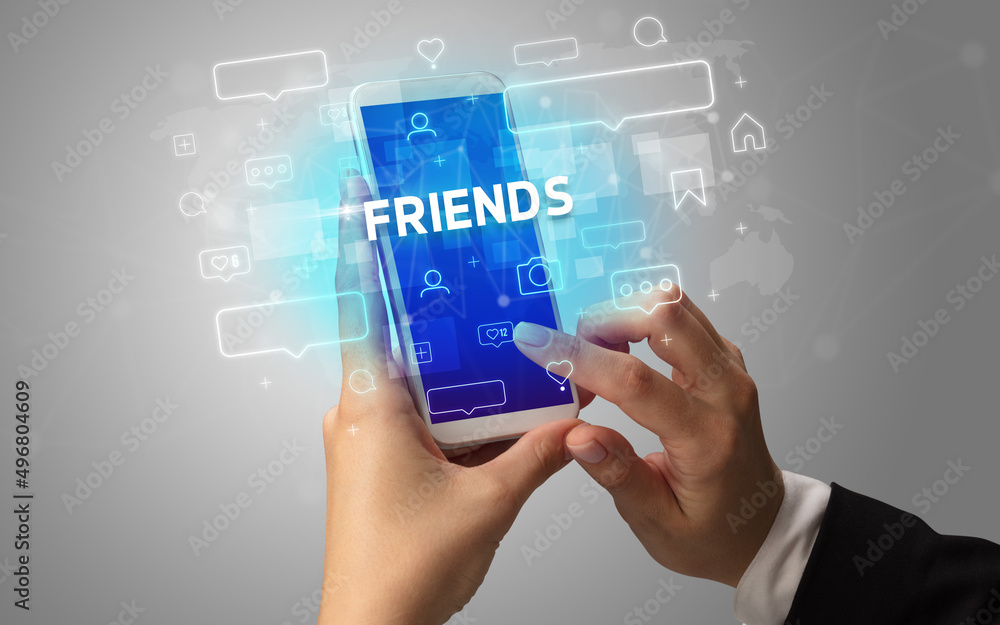 Hand using smartphone with social media concept