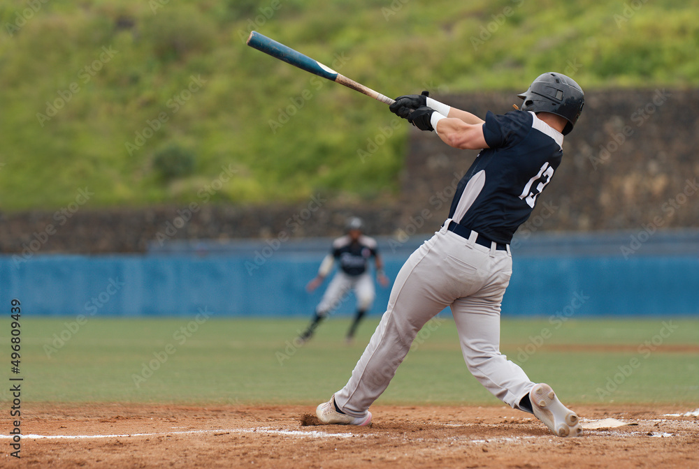 Baseball players in action on the stadium, baseball batter waiting to strike the ball Baseball players in action on the stadium, baseball batter waiting to strike the ball