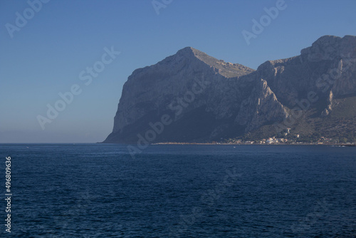 evocative image of sea coast with promontory on the background in Sicily, Italy  © massimo
