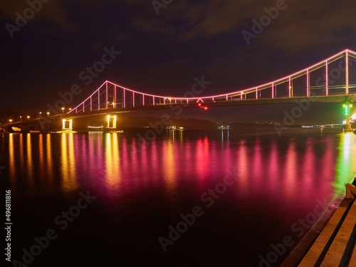 Fototapeta Naklejka Na Ścianę i Meble -  Pedestrian bridge in Kiev. Evening lighting.