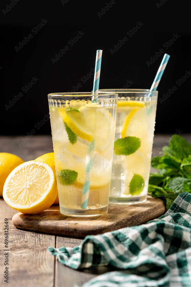 Fototapeta premium Glass of fresh lemonade on wooden table