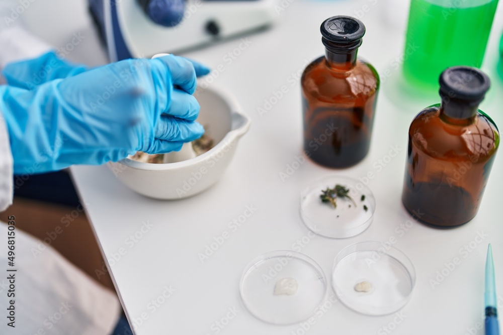 African american woman wearing scientist uniform working laboratory African american woman wearing scientist uniform working laboratory