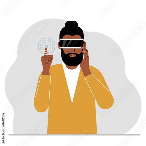 The concept of augmented or extended reality. Man wearing 3D glasses or virtual reality headset.