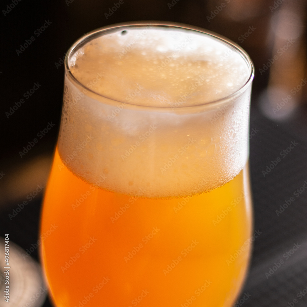 full glass of golden craft beer square full glass of golden craft beer square