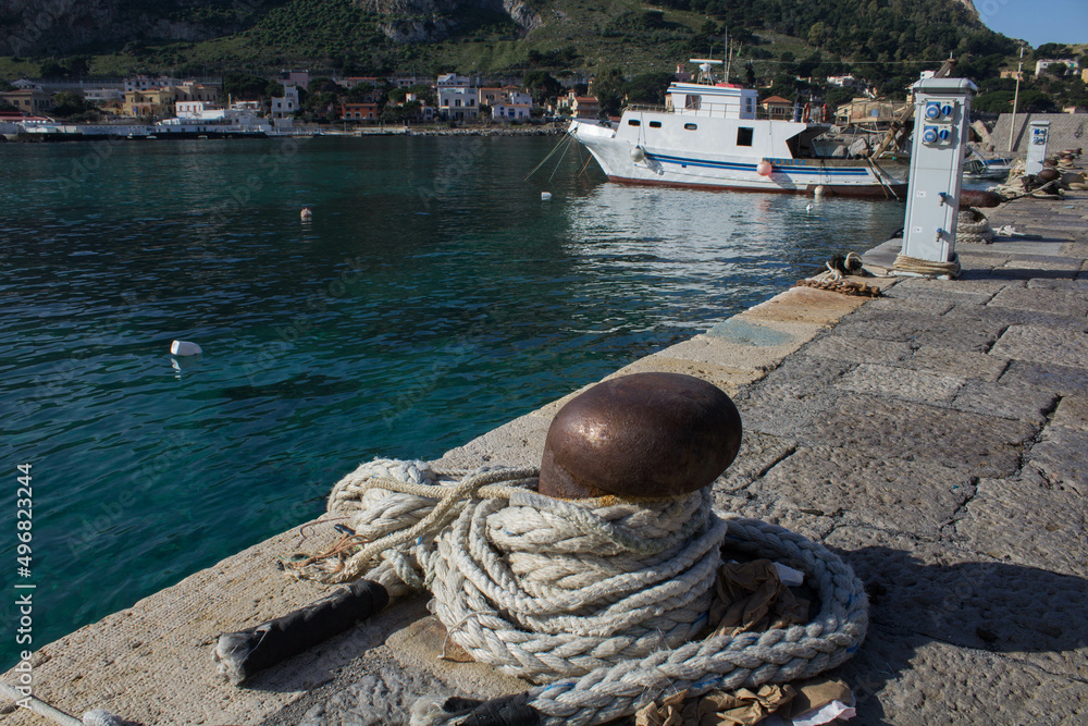 Obraz premium evocative image of the anchor point for boats in the port in a small fishing village in Sicily, Italy 