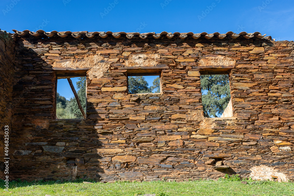 Old abandoned mill in extremadura meadow