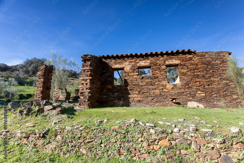 Old abandoned mill in extremadura meadow