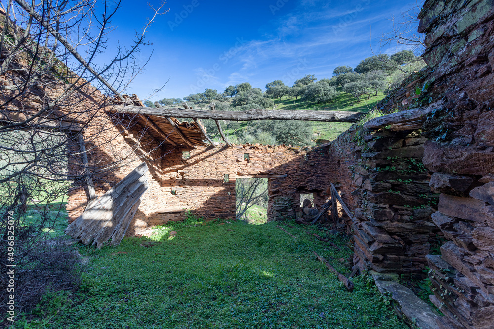 Old abandoned mill in extremadura meadow