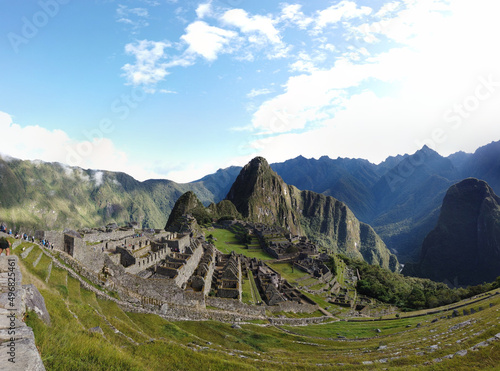 Shot of Machu Picchu bouildings surrounded by mountains photo