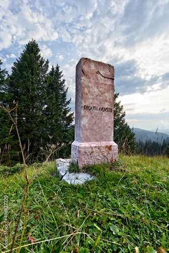 Memorial stone of the Trentino legion in memory of the battles of the Great War in Mount Pioverna. Folgaria, Trentino, Italy. photo