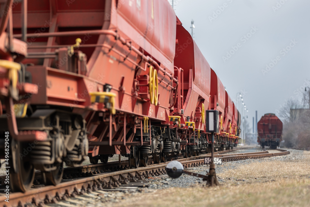 Train wagons carrying freight containers for shipping companies. distribution and freight transport by a railway, transport concept Train wagons carrying freight containers for shipping companies. distribution and freight transport by a railway, transport concept