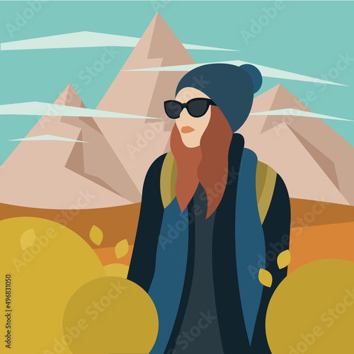 Chica con gorro y gafas de excursión en la montaña